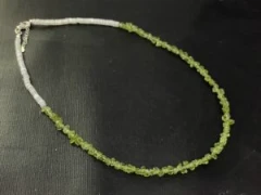 Necklace in green peridot and white shell
