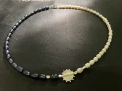 Black and white baroque pearl with silver bar and central motif necklace
