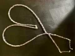Necklace in pale pink glass bead and silver chain ends