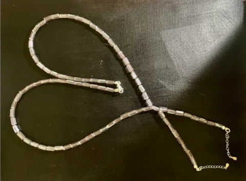 Necklace in pale pink glass bead and silver chain ends