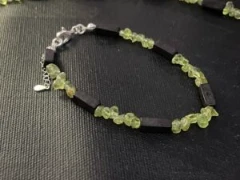 Bracelet in black stone and green Peridot