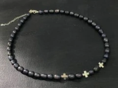 Black pearl with 3 silver cross necklace.