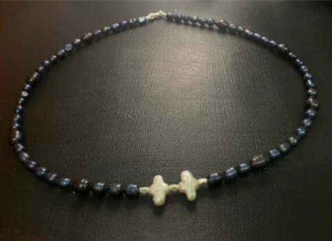 White cross shaped pearl with black baroque pearl and silver bar necklace