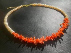Coral pieces with baroque pearl necklace