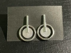 Geometric hammered silver earrings with stud closure
