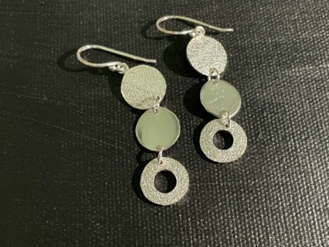 Circle drop earrings in hammered finish silver