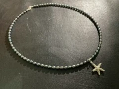 Necklace in  black baroque pearl with 925 silver starfish charm