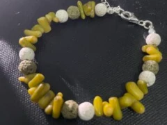 Bracelet in combination white, green lava stone with yellow green coral