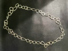 Long chain geometric form links in 925 silver hammered finish.