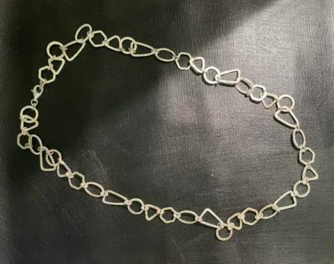 Long chain geometric form links in 925 silver hammered finish.