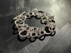 Artisanal designed multi circle unisex bracelet with toggle clasp  in solid silver
