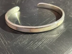 Shell inlay with silver unisex cuff bracelet.