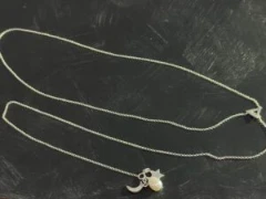Lariat necklace in full silver with triangle loop and charms of silver star, moon with pearl