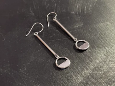 Long drop earrings with half circle motif in full silver